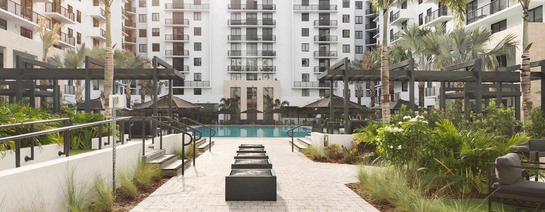 umbrella shaded seating around pool