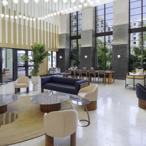 lounge area at Biscayne 112 with a variety of seating areas and floor to ceiling windows