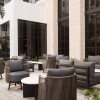 a courtyard with tables and chairs