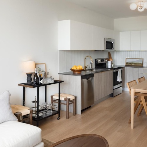 open floorplan at Biscayne 112 with kitchen table and bar cart